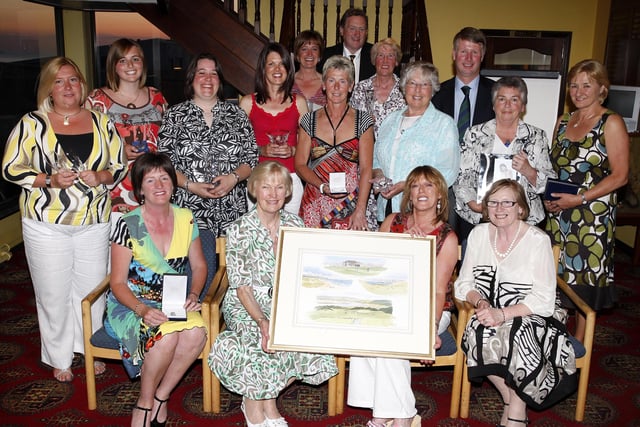 Jean Robinson, lady captain, presents Lynne Gibb with the overall winner prize during the Portstewart Golf Club Lady Captain's Day prize night in May 2008. Included are other prizewinners and sponsors