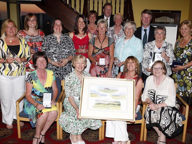 Jean Robinson, lady captain, presents Lynne Gibb with the overall winner prize during the Portstewart Golf Club Lady Captain's Day prize night in May 2008. Included are other prizewinners and sponsors
