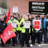 Caterpillar NI employees and Unite union members form a picket at the company's west Belfast plant on April 11. It was revealed last week by Unite the Union that Lisburn and Castlereagh council workers intend to stage a strike after talks about a pay increase failed. Picture: Jonathan Porter/PressEye