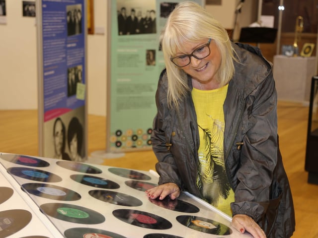 Helena Alcorn Espie browses some of the items on display in the new exhibition, ‘Let Me Introduce You: A History of Dance Halls in the Causeway Area’, which is now open in Coleraine Town Hall