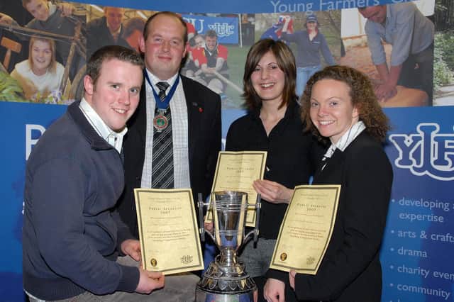 WELL DONE... YFCU President Adrian Cooper presents the prizes to the first to third place winners of the Class H 21-25 Years Impromptu section at this year’s Final of the Young Farmers’ Club of Ulster Public Speaking Competition.  (Second right) Karen McIlroy (Kilrea YFC) received the NFU Cup and W A and O M Craig Award for first place; Rosalind Ellis (Kells and Connor YFC) received a certificate for second place and Paul Dunn (Donaghadee YFC) received a certificate for third place.