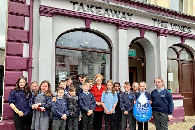 Pupils from Carhill Integrated Primary School pictured with Brenda from The Vine takeaway in Garvagh which has signed up to Causeway Coast and Glens Borough Council’s H20 On The Go scheme