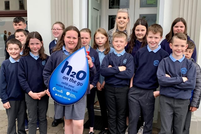 Pupils from Carhill Integrated Primary School pictured outside The Imperial in Garvagh which has signed up to Causeway Coast and Glens Borough Council’s H20 On The Go scheme