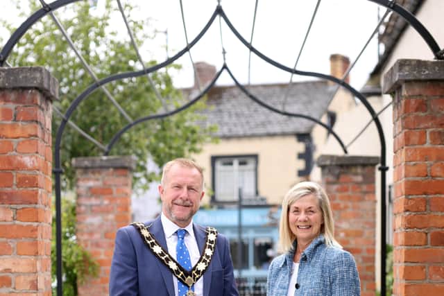 Mayor of Antrim and Newtownabbey, Alderman Stephen Ross with Helen Boyd, Chair of the Tidy Randalstown showcasing the latest street furniture investment in Randalstown