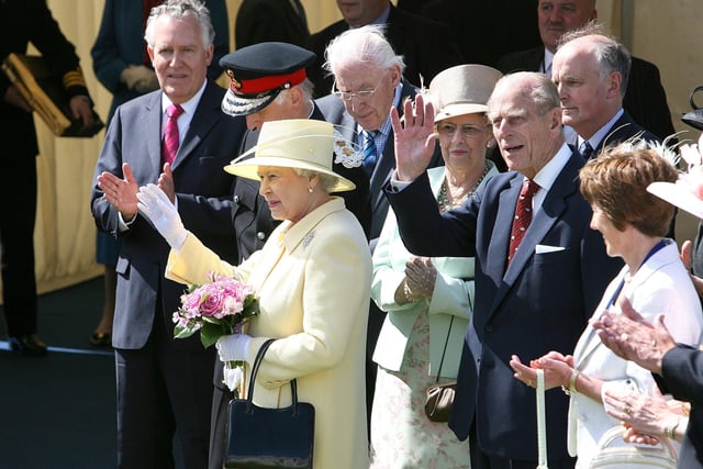 The Queen and Prince Philip wave to the crowds in Coleraine during the garden party at Ulster University back in 2007