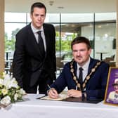 Mayor, Councillor Scott Carson has officially opened the council's Books of Condolence for The Queen. (Credit: Lisburn and Castlereagh City Council Facebook)
