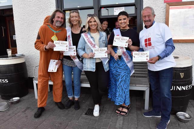 Pictured at the launch of this year’s 'Wee Joan’s Dog Walk’ in Portrush are Scooby-Doo (Willie Gregg) and Raymond Pollock MBE, both members of the Northern Ireland Children to Lapland’s North Coast Fundraising Committee, and Laura Lockhart, Bronagh Mullan and Nula Mullan