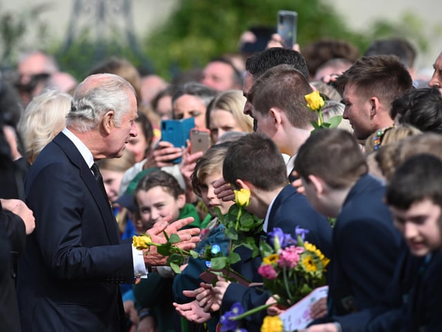 King Charles III and the Queen Consort greet members of the puplic as they arrive at Hillsborough Castle, Co Down. Picture date: Tuesday September 13, 2022.