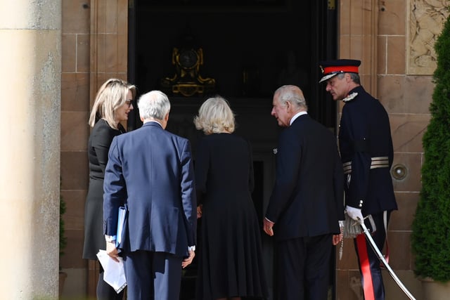 King Charles III and the Queen Consort (centre) arrive at Hillsborough Castle, Co Down. Picture date: Tuesday September 13, 2022.