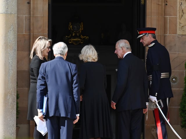King Charles III and the Queen Consort (centre) arrive at Hillsborough Castle, Co Down. Picture date: Tuesday September 13, 2022.