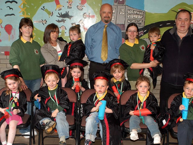 Eileen McKeever, Aodain MacSheafraidh, Marie Mhic Coimnigh and Tony Molvenna join parents and pupils of Naiscoil Choin Ri Uladh nursery group who graduated last week in Dunclug Community Centre. BTFR27-805h