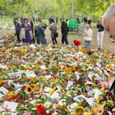 The Mayor of Causeway Coast and Glens Borough Council, Councillor Ivor Wallace, views some of the floral tributes during his trip to London