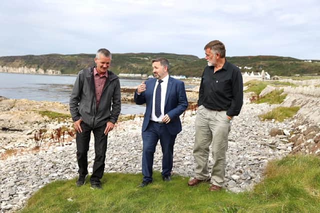 Minister with Michael Cecil and David Quinney-Mee Rathlin Development and Community Association