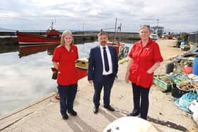 The Minister with island nurses Kiera McKillop and Jackie Devine