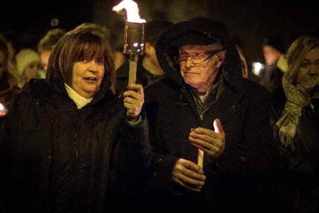 John McAnespie with his daughter Margo during a vigil for his son Aiden.