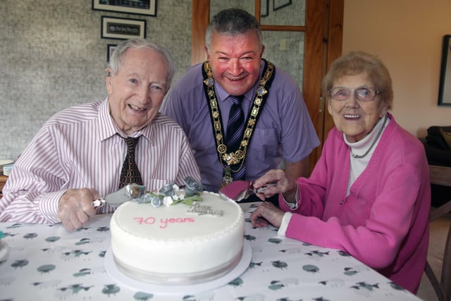 Alex and Agnes McElreavey who celebrated their 70th wedding anniversary on September 10  pictured with the Mayor of Causeway Coast and Glens Borough Council, Councillor Ivor Wallace
