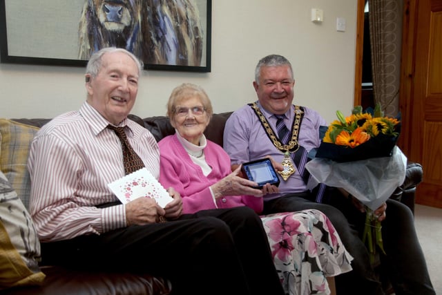 Alex and Agnes McElreavey who celebrated their 70th wedding anniversary on September 10, pictured with the Mayor of Causeway Coast and Glens Borough Council, Councillor Ivor Wallace
