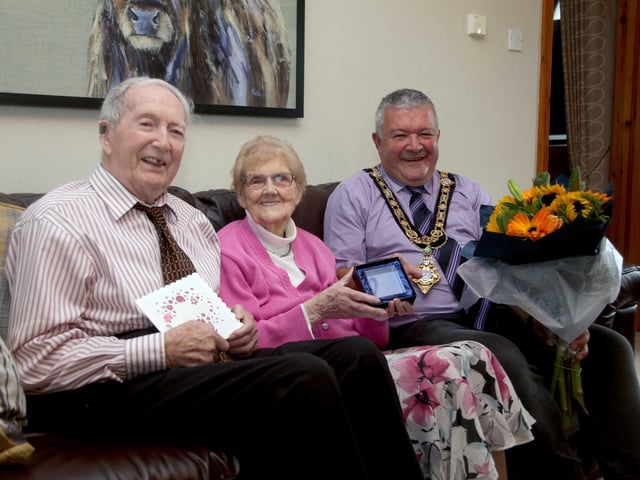 Alex and Agnes McElreavey who celebrated their 70th wedding anniversary on September 10, pictured with the Mayor of Causeway Coast and Glens Borough Council, Councillor Ivor Wallace
