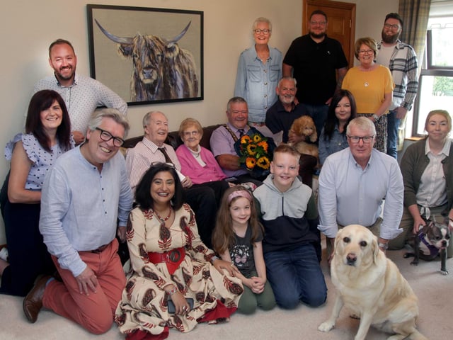 Alex and Agnes McElreavey who celebrated their 70th wedding anniversary on September 10 pictured with the Mayor of Causeway Coast and Glens Borough Council, Councillor Ivor Wallace, and their three children, Valerie, John and Kenneth, along with extended family members including grandchildren Chris, Barbara and Andrew, and great grand-children Lewis and Emilia.