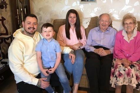 Alex and Agnes McElreavey who celebrated their 70th wedding anniversary on September 10th 2022 pictured with their grand-daughter Laura, her husband Trevor and great-grandson Oliver