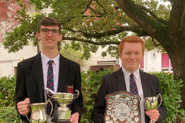 Ballyclare High's top GCSE students Andrew Doherty and Will Montgomery with the McMullan Cup and Foweather Prizes.