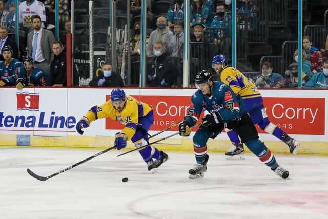 Giants' Kevin Raine with Fife Flyers' Greg Chase during a Challenge Cup game at The SSE Arena, Belfast, last season. Picture by  Matt Mackey / Press Eye.