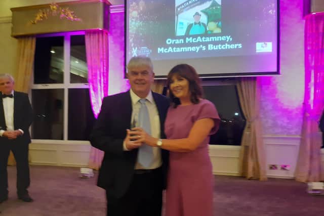 Oran McAtameny of McAtamney's Butchers receiving his award.