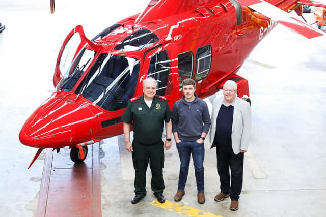 Pictured at the announcement of Air Ambulance NI’s purchase of its first helicopter and launching the charity's Lift off Together Campaign are: Dr Nigel Ruddell (Medical Director, Northern Ireland Ambulance Service), the first AANI patient, Conor McMullan and Dr David McManus (Chair AANI) with the new helicopter that’s due to take flight as the Air Ambulance NI’s primary helicopter by late summer 2026. Picture: Darren Kidd / Press Eye    Press Release For Immediate issue Monday 8th June 2026    Lift off Together: Air Ambulance NI marks major milestone with investment in its first-owned helicopter  A longheld ambition for Air Ambulance Northern Ireland has been to own its primary helicopter, and today, the charity is proud to announce the purchase of a new AW109SP.  Representing a major milestone in Air Ambulance NI’s journey since its inception back in 2017, the new aircraft has been procured through Sloane Helicopters and manufactured by Leonardo Helicopters, and it’s scheduled to become Air Ambulance NI’s primary helicopter from later summer 2026.  Following years of financial planning and supporters’ generosity, including contributions from Gifts in Wills, the new aircraft is currently in the final stages of testing and medical fit-out. The new aircraft, which will carry the registration G-HMNI, is due to take flight as the Air Ambulance NI’s primary helicopter by late Summer 2026.   For nearly nine years, Air Ambulance Northern Ireland, working in partnership with the Northern Ireland Ambulance Service, has been a vital lifeline for communities, responding to over 5,500 emergency call-outs and saving countless lives. On average, the service responds to 60 calls per month.  Commenting on this next phase in Air Ambulance NI’s journey, Dr David McManus, Chair of Air Ambulance Northern Ireland, adds: “Securing a new helicopter represents a transformational moment for Air Ambulance NI and a vital commitment to saving lives across Northern Ireland. This aircraft will offer us a
