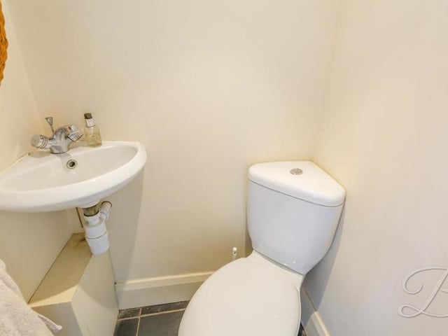 Every home should have a downstairs toilet - and here is the one at the Berry Hill property. It boasts a low-flush WC and wash hand basin.