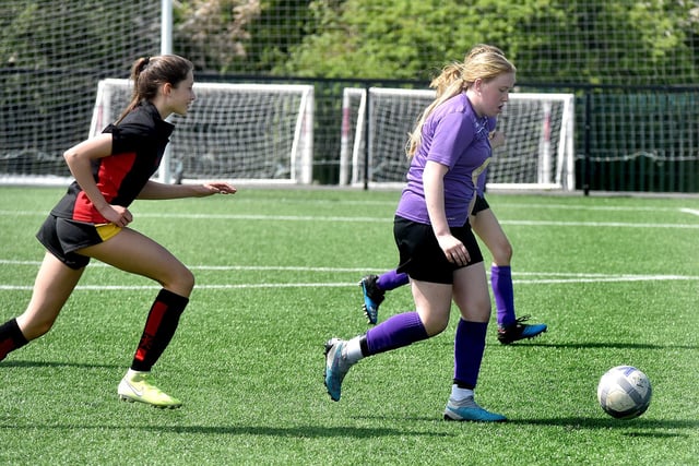Brownlow Integrated College (purple) players in action at the Electric Ireland schoolgirls soccer tournament at Lurgan Town FC on Friday. PT21-226.