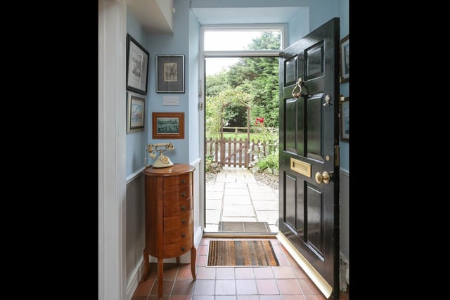 Entrance hall with quarry tiled floor.