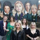 Derry Girls creator Lisa McGee, second from left, with cast members Dylan Llewellyn , Saoirse-Monica Jackson, Louisa Harland and Nicola Coughlan pictured at the 'Derry Girls' mural. Picture: Lorcan Doherty / Press Eye