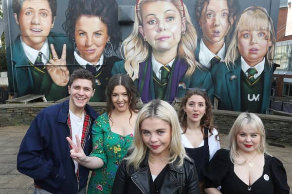 Derry Girls creator Lisa McGee, second from left, with cast members Dylan Llewellyn , Saoirse-Monica Jackson, Louisa Harland and Nicola Coughlan pictured at the 'Derry Girls' mural. Picture: Lorcan Doherty / Press Eye