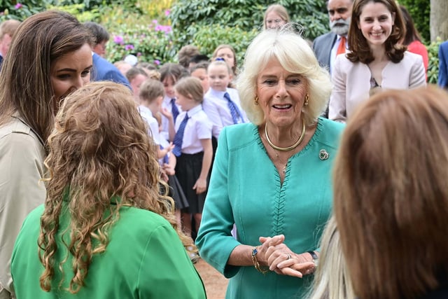 Queen Camilla chats with some of the crowd that had gathered at Hazelbank Park. Picture: Colm Lenaghan/Pacemaker