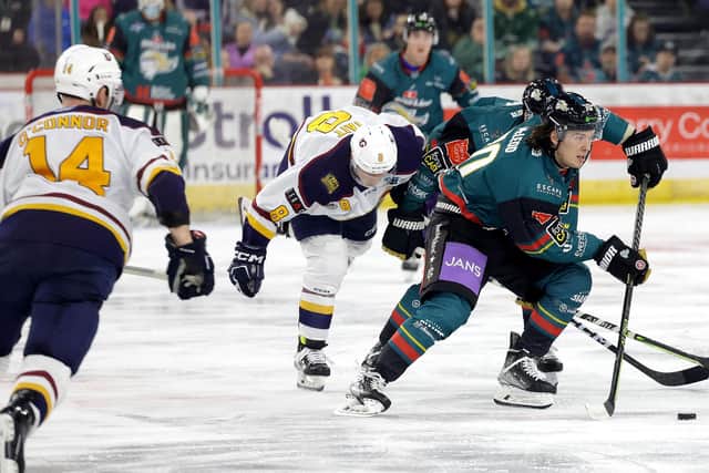 Belfast Giants’ Matthew Mcleod with Guildford Flames' Ryan Tate during Saturday night’s Elite Ice Hockey League game at the SSE Arena, Belfast.     Photo by William Cherry/Presseye