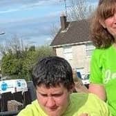 Jessica Conway pictured with Tristan. Jessica is planning to run 12 hours to raise funds to buy Tristan a new wheelchair so he can come with her on training runs. Credit: Submitted