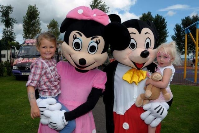 Amelia-Rose Hopkins and Emma Abbott get a lift around the Shoreline Festival in 2014.