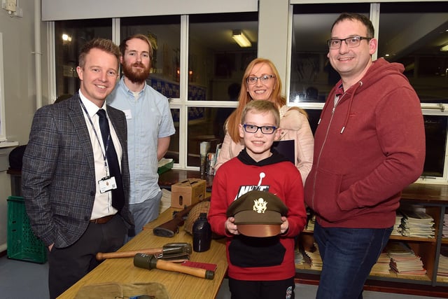 Having a look at some of the WWII memoribilia in the History department during the Lurgan Junior High School open night are from left, Mr Michael Addley, History teacher; James Martin, Brownlow House Museum; Emma Parks, son Jacob and his dad, Alistair. LM02-200.