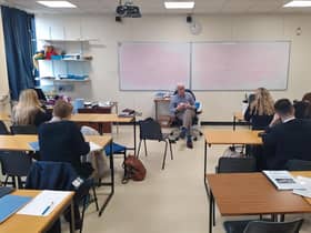Dr Kirkpatrick with Six Formers at Wallace High