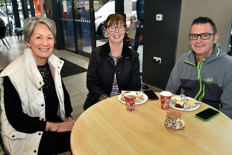 Having a coffee for a good cause at the Ballylisk Car Sales charity event on Saturday are, from left, Gladys Shortt with Anita and Robert Vennard. PT50-276.