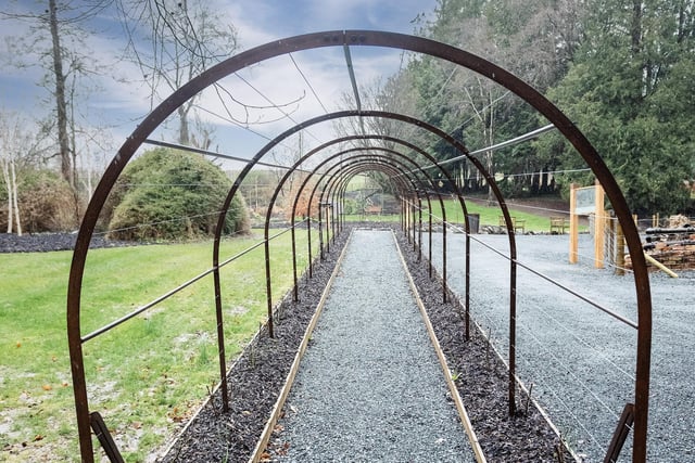 An exact replica of the rose arbour discovered in disrepair by the team has been designed and created by local engineer John Lyons.