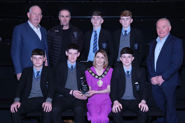 Pictured at the Civic Awards with Chair of the Council, Councillor Córa Corry are the St Patrick's College, Maghera Leonard Cup winners with nominating councillors Sean McPeake and Brian McGuigan.