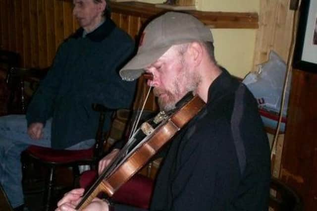 Marinus (Marinie) Toman playing the fiddle in Dunkineely, Co Donegal