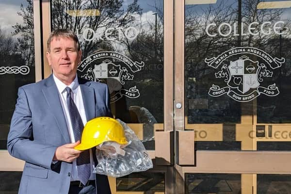 Stephen Gallagher, Principal of Loreto College, Coleraine, taking delivery of his new hard hat in preparation for the recommencement of the Capital Build Project at the
school announced by the Minister of Education. Credit Loreto College