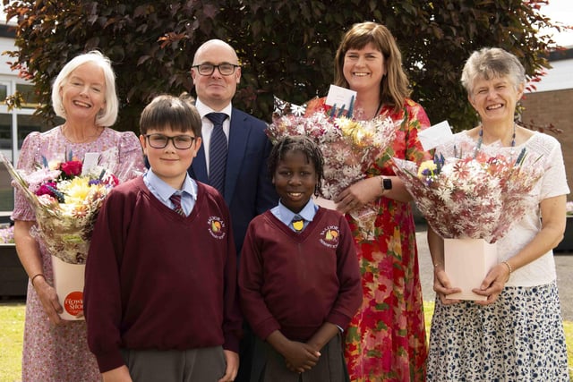 Ballyoran PS principal, Mr Woolsey along with pupils Cain Creaney and Sara Das Neves (pupil council) bid farewell to three valued members of staff: from left: Lesley Walker, Mrs Martin and Mrs Barkley.