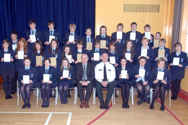 Some of the pupils from Dromore High School who received good conduct and attendance certificates at a special assembly held in the school in 2010. The certificates were presented by Sgt Paul Fergusson, Dromore Neighbourhood Policing. Also included is Mr John Wilkinson, principal.