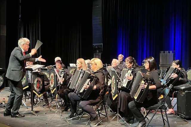 Clyde Johnston conducting the East Antrim Seniors Accordion Orchestra.