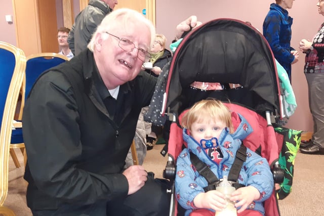 Sean McCann from Lurgan with young Mark Hart who attended the Southern Area Hospice Light Up a Life ceremony at Craigavon Civic Centre on Tuesday.