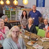 Dr Kirkpatrick with young people and volunteers from Via Wings’ Learning 360 programme. The Learning 360 students are young people who take part in some hands-on kitchen training to help them gain future employment.  They help to create ready meals that go out to the elderly in the community.