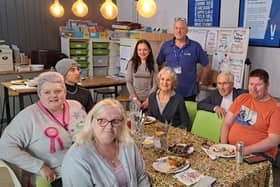 Dr Kirkpatrick with young people and volunteers from Via Wings’ Learning 360 programme. The Learning 360 students are young people who take part in some hands-on kitchen training to help them gain future employment.  They help to create ready meals that go out to the elderly in the community.